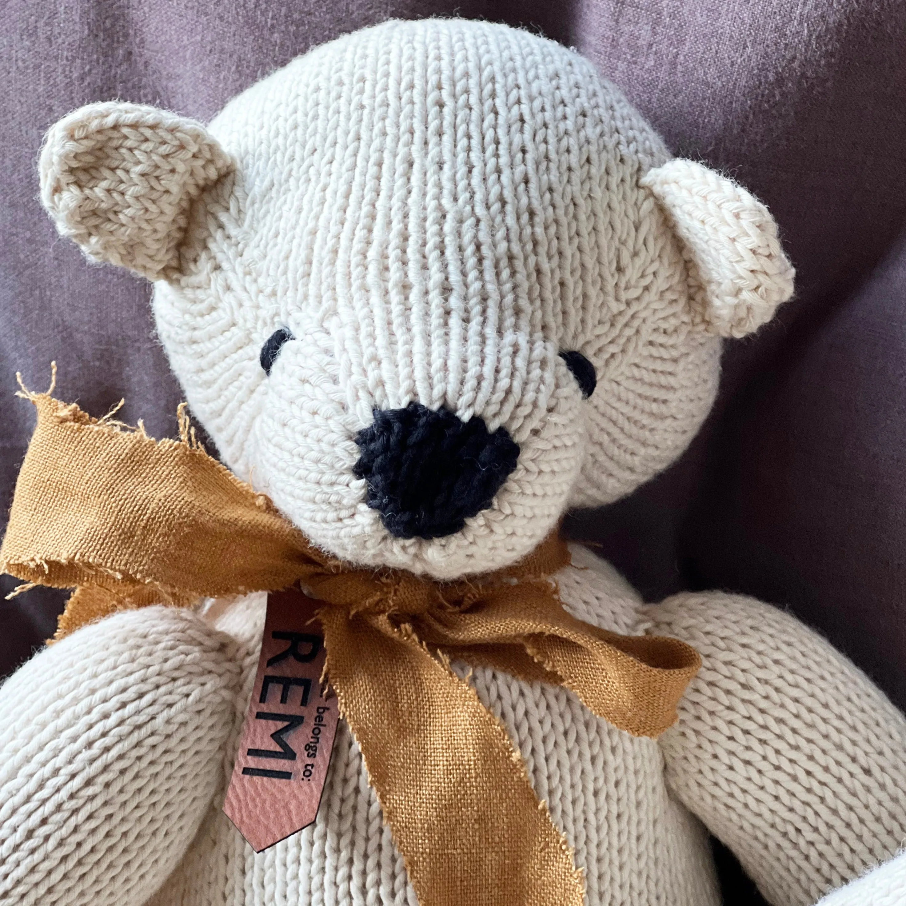 Beautiful hand Knitted Bear with Personalised Faux Leather Tag